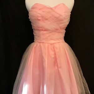 Cute pink strapless dress.